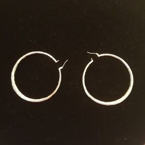 Silvertone hollow hoop earrings